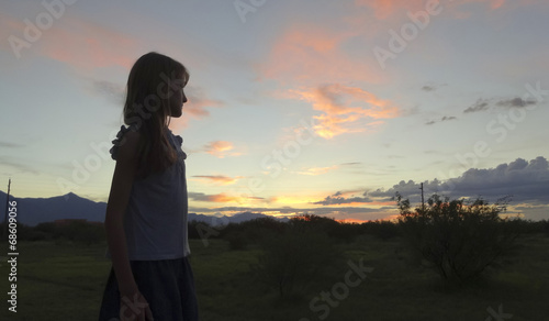 A Girl in Profile as the Sun Sets © Derrick Neill