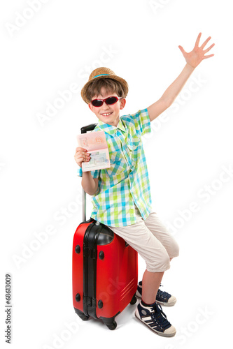 The young tourist with suitcase and passport with visa