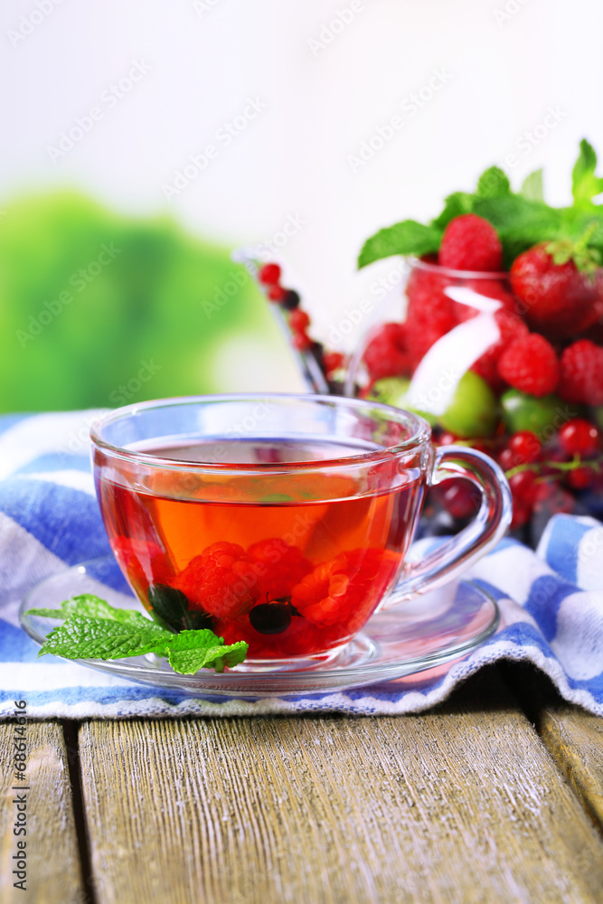 Fruit red tea with wild berries in glass cup, Fruit red tea with wild berries in glass cup,