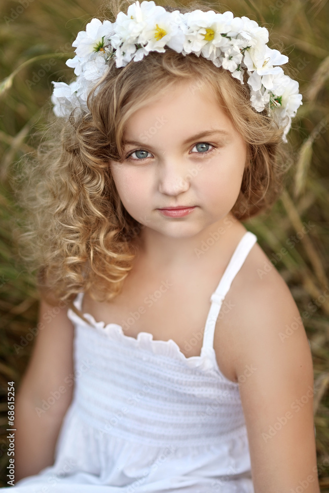 portrait of a beautiful little girl in a field portrait of a beautiful little girl in a field