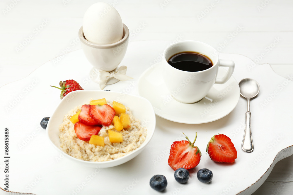 Delicious breakfast with coffee, egg and oatmeal Delicious breakfast with coffee, egg and oatmeal