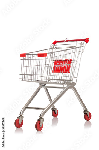 Shopping supermarket trolley isolated on the white © Elnur