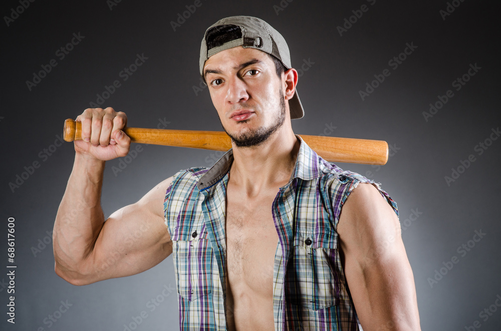 Violent man with baseball bat and hat