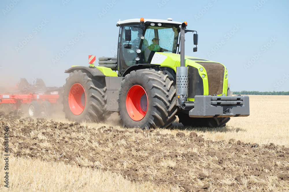 tractor with a plow tractor with a plow