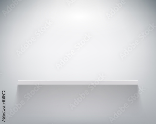 empty shelf on white wall