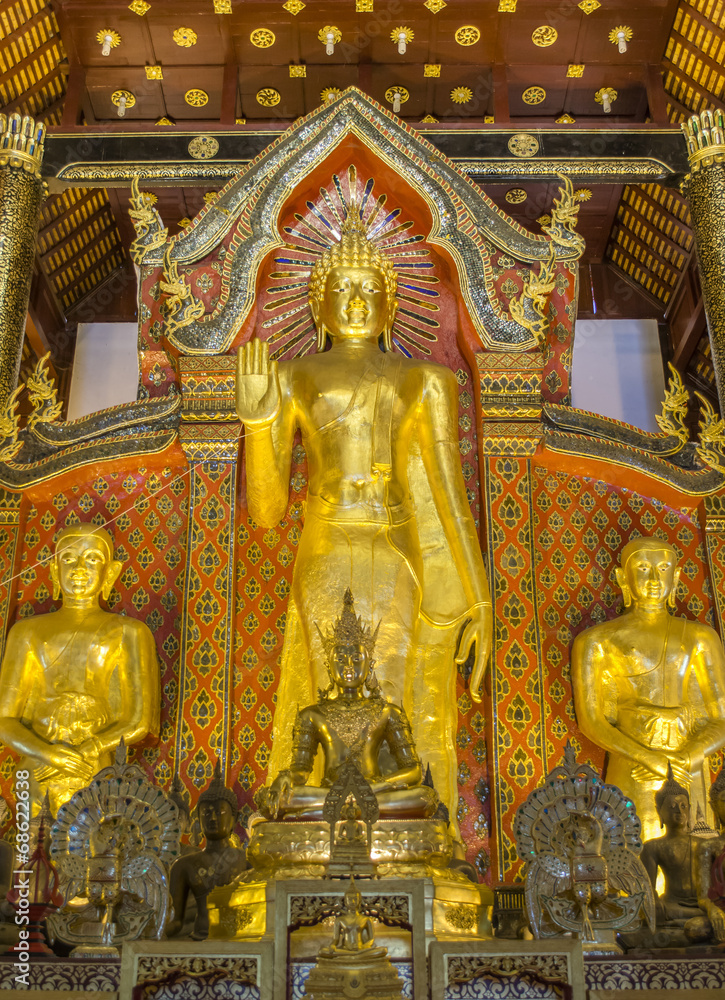 gold Buddha  statue in temple of Thailand.
