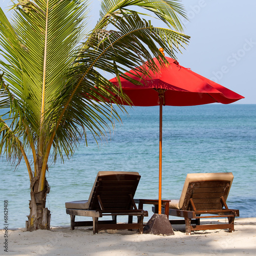 Beach chair and umbrella on the beach , Thailand