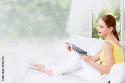  woman excited holding tablet 