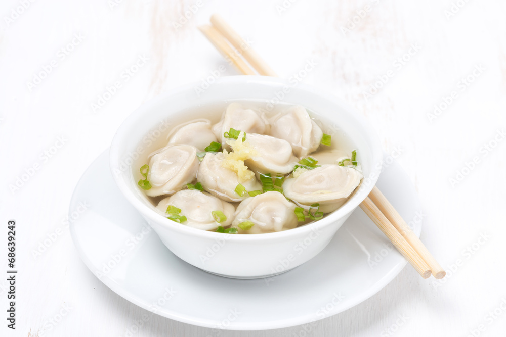 chicken broth with Chinese dumplings, horizontal
