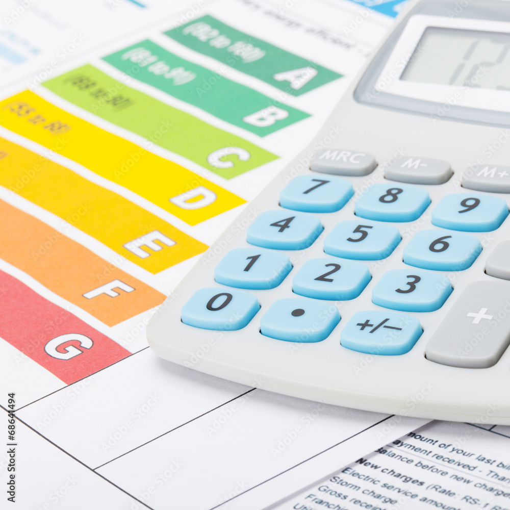 Energy efficiency chart with calculator - studio shot Energy efficiency chart with calculator - studio shot