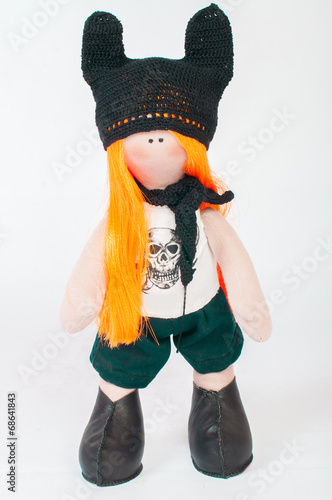 Textile souvenir doll in rock costume photo