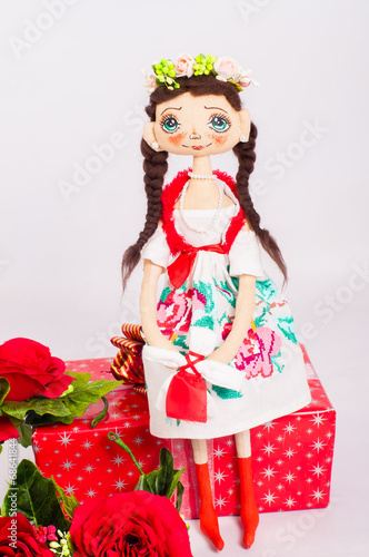 Textile souvenir doll in national costume photo