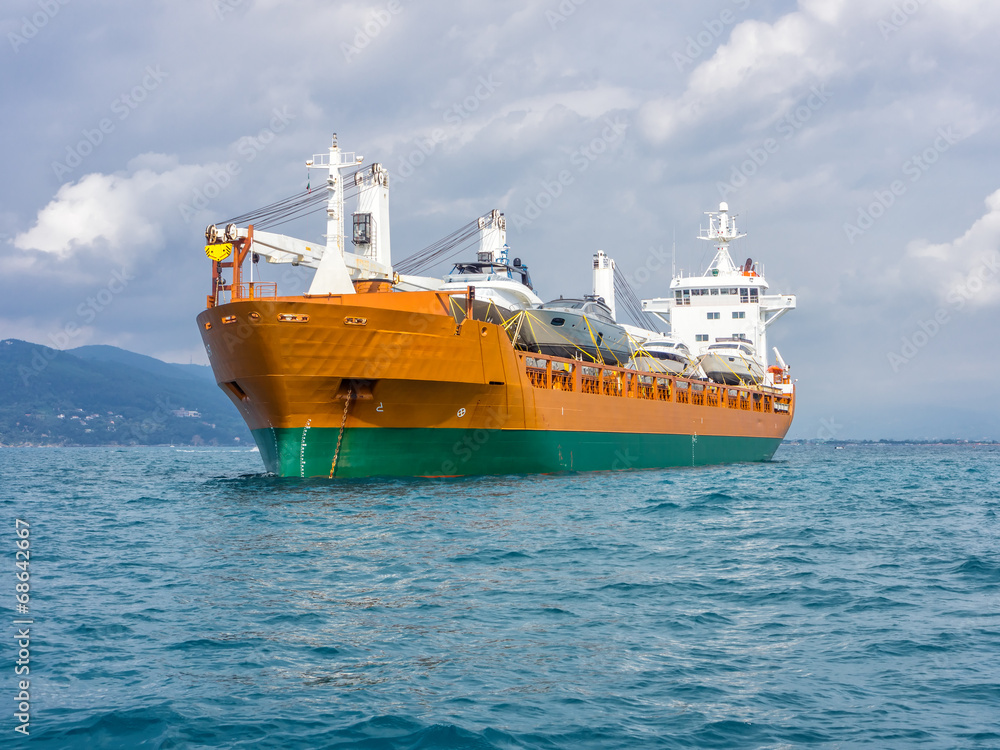 cargo ship moving boats