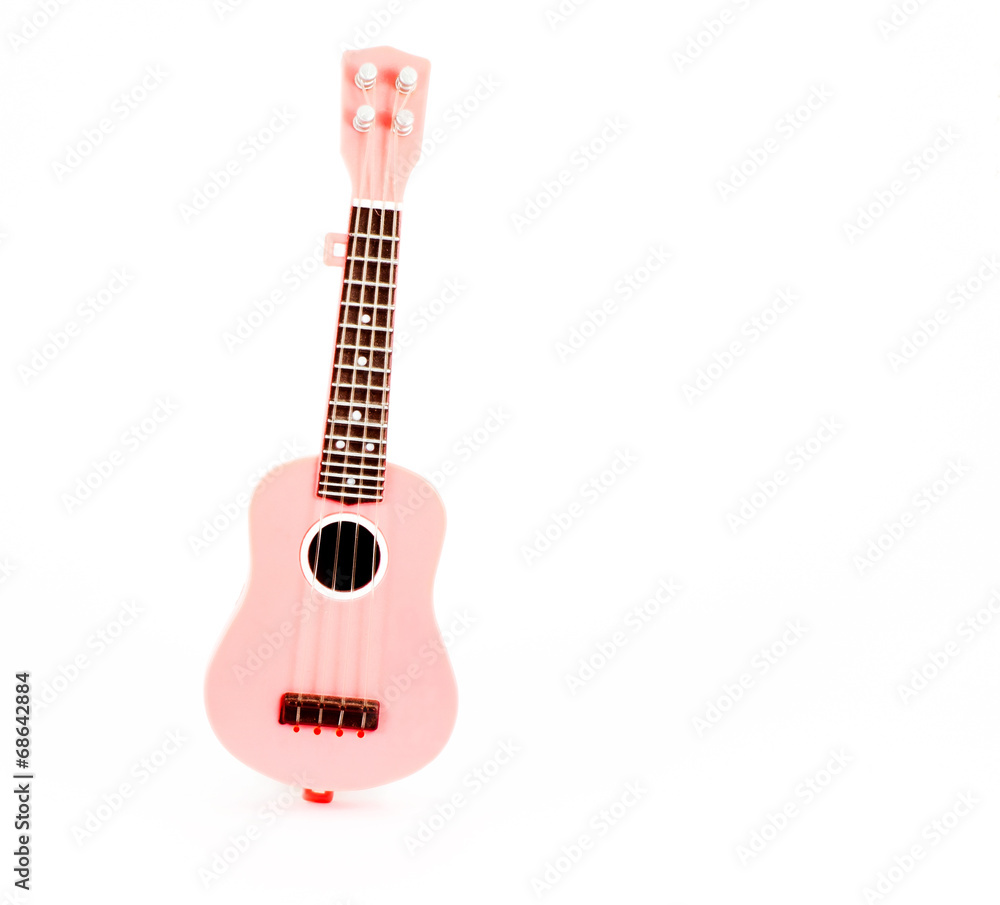 pink guitar toy isolated on white background pink guitar toy isolated on white background