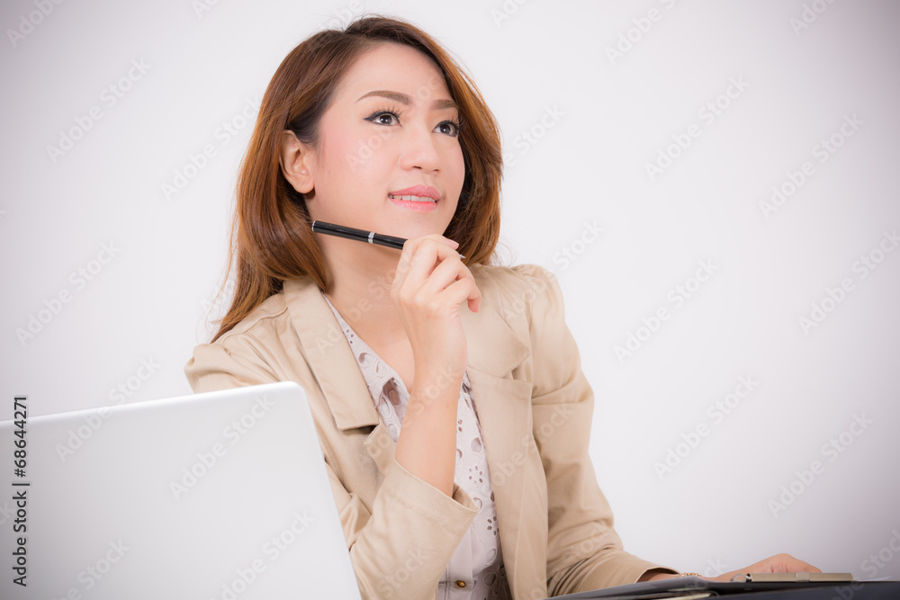 Portrait of a young business woman using laptop at office Portrait of a young business woman using laptop at office