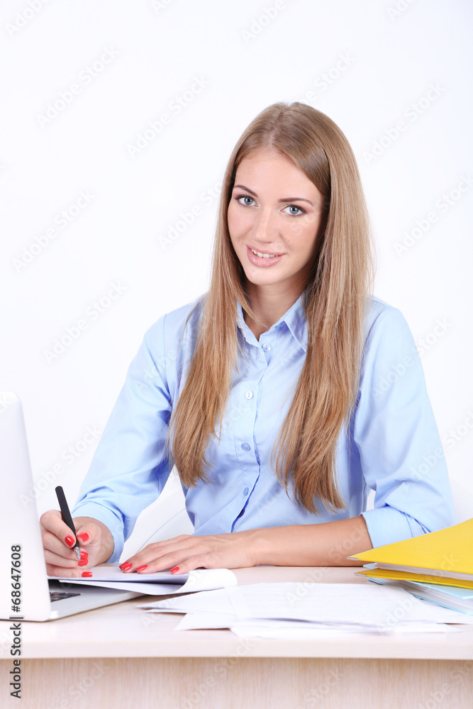 Business woman with documents at her workplace Business woman with documents at her workplace
