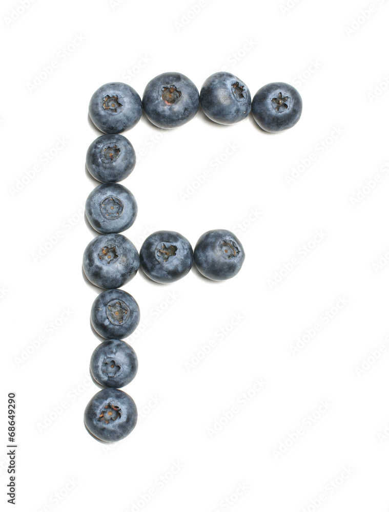 Alphabet letter F arranged from highbush blueberry isolated