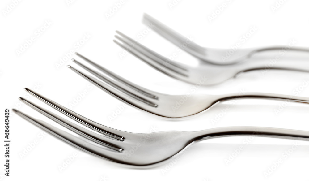 Metal small dessert forks isolated on white Metal small dessert forks isolated on white