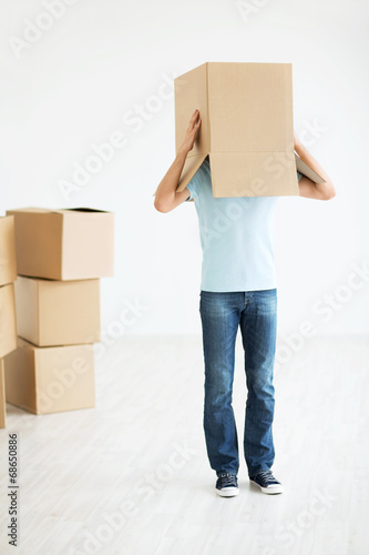 Man with a box at home
