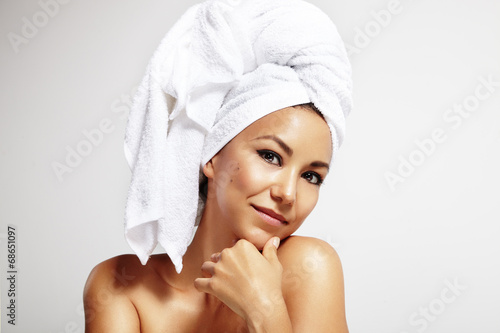 latin woman with the bath towel on the head