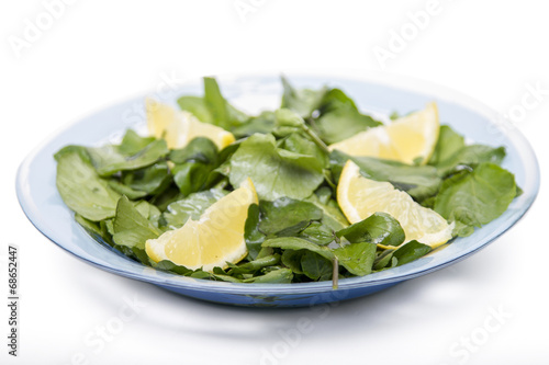fresh and healthy watercress salad with lemon.