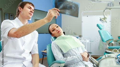 Young woman with dentist in a dental surgery. Healthcare