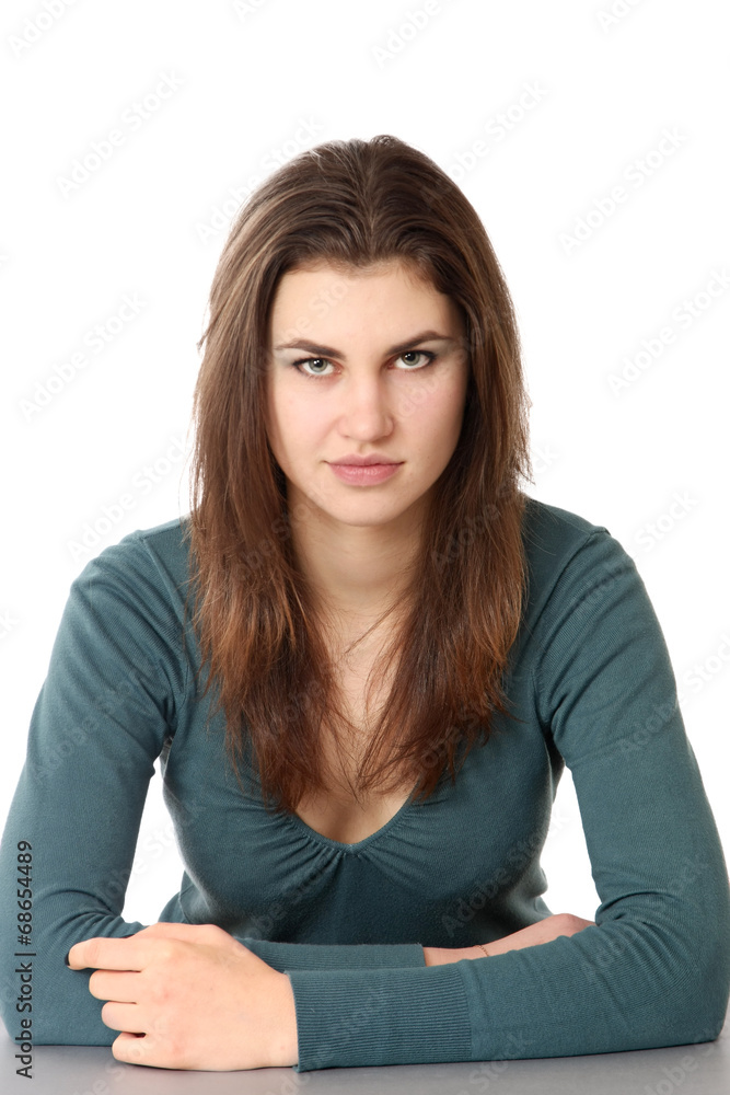 Smiling woman sitting at the desk, isolated on white background Smiling woman sitting at the desk, isolated on white background