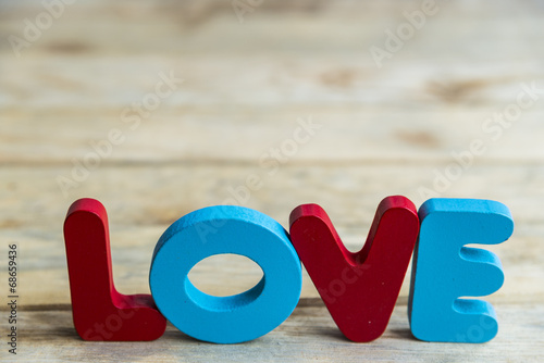 Colorful wooden word Love on wooden floor2