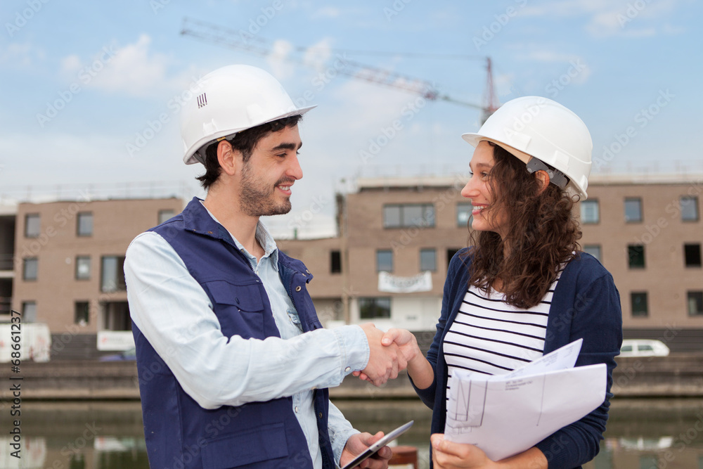Architect woman and construction site supervisor Architect woman and construction site supervisor