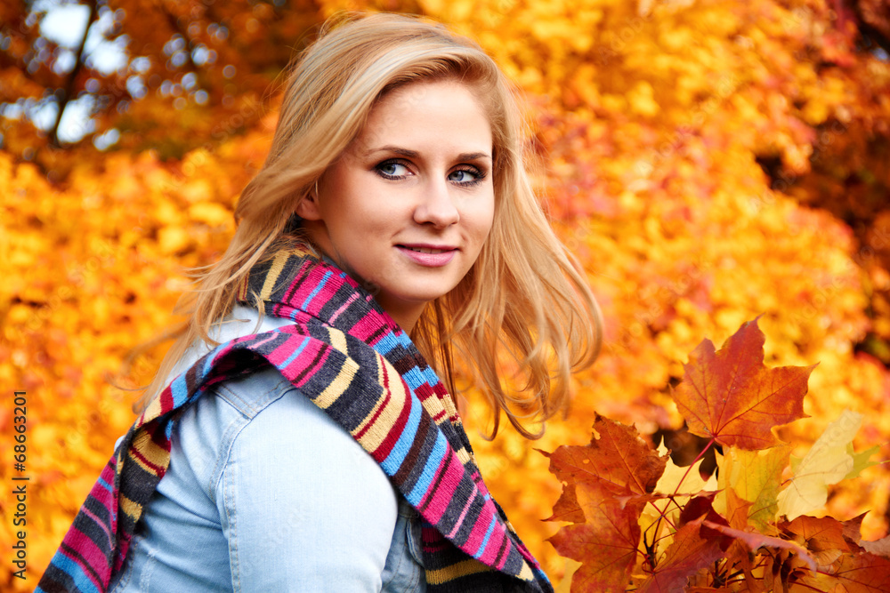 Beautiful woman in a park in autumn Beautiful woman in a park in autumn