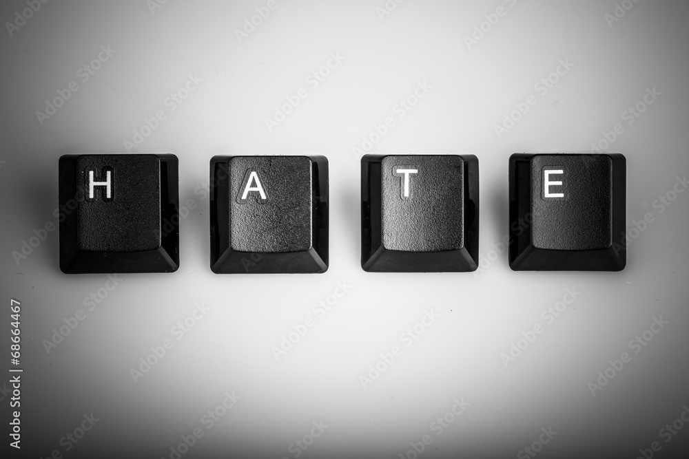 text hate formed with computer keyboard keys on white background