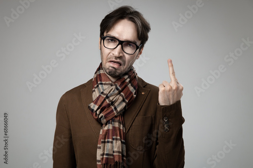Hipster style angry man doing the fuck you sign