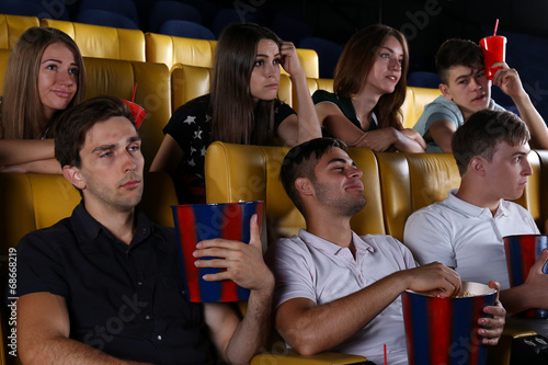 Young people watching movie...