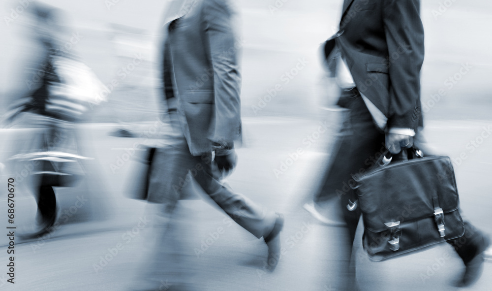 © bluraz - motion blurred business people walking on the street