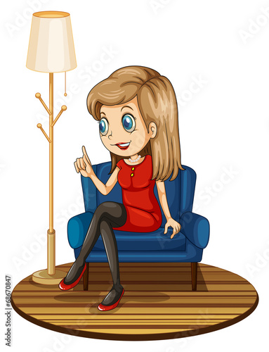 A girl sitting at the blue couch