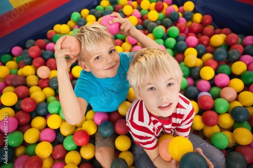 Happy children playing in ball pool