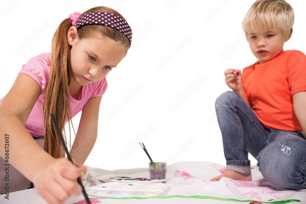 Happy little children painting on the floor Happy little children painting on the floor