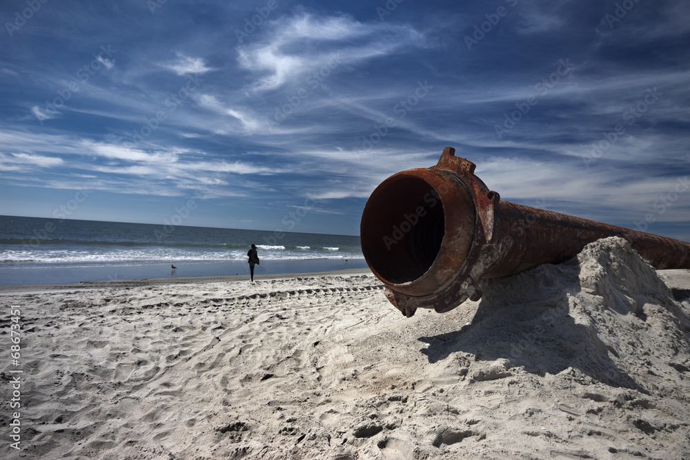 rusty pipes along the sea beach