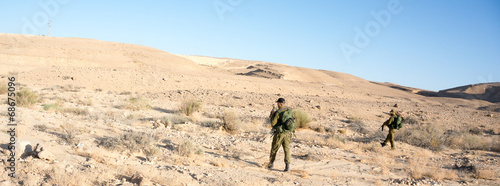 Soldiers patrol in desert © Pavel Bernshtam