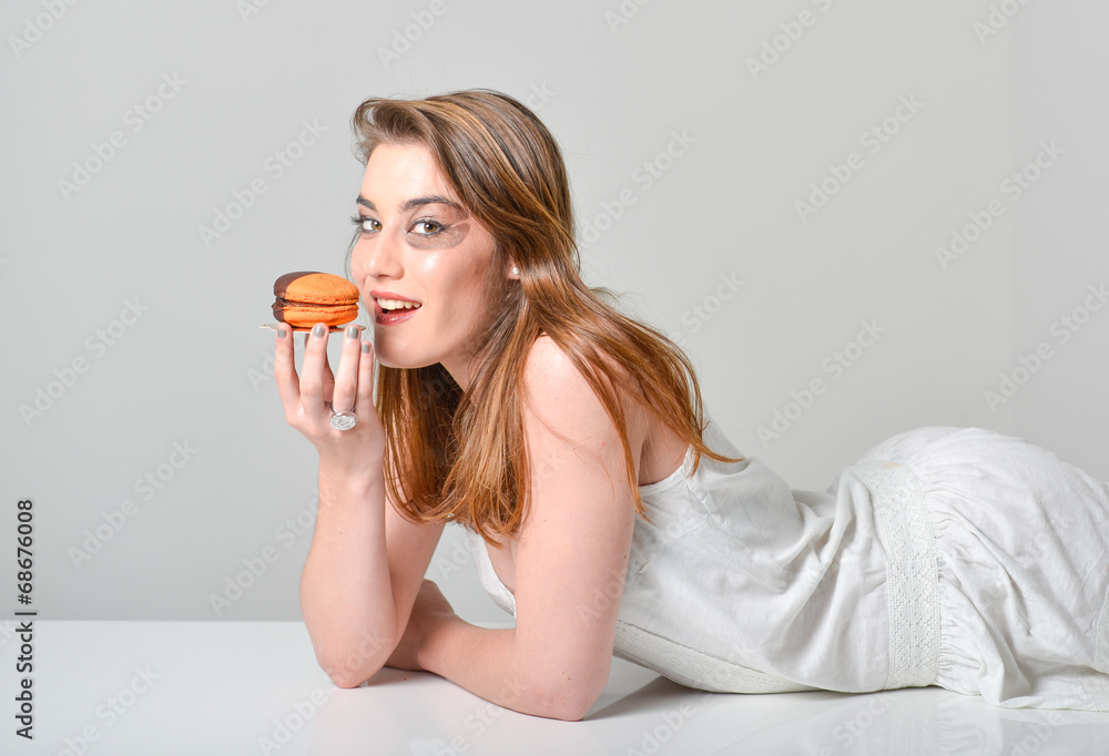glamour make-up young woman tasting brown orange macaroon glamour make-up young woman tasting brown orange macaroon