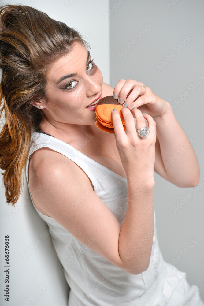 glamour make-up young woman tasting brown orange macaroon glamour make-up young woman tasting brown orange macaroon