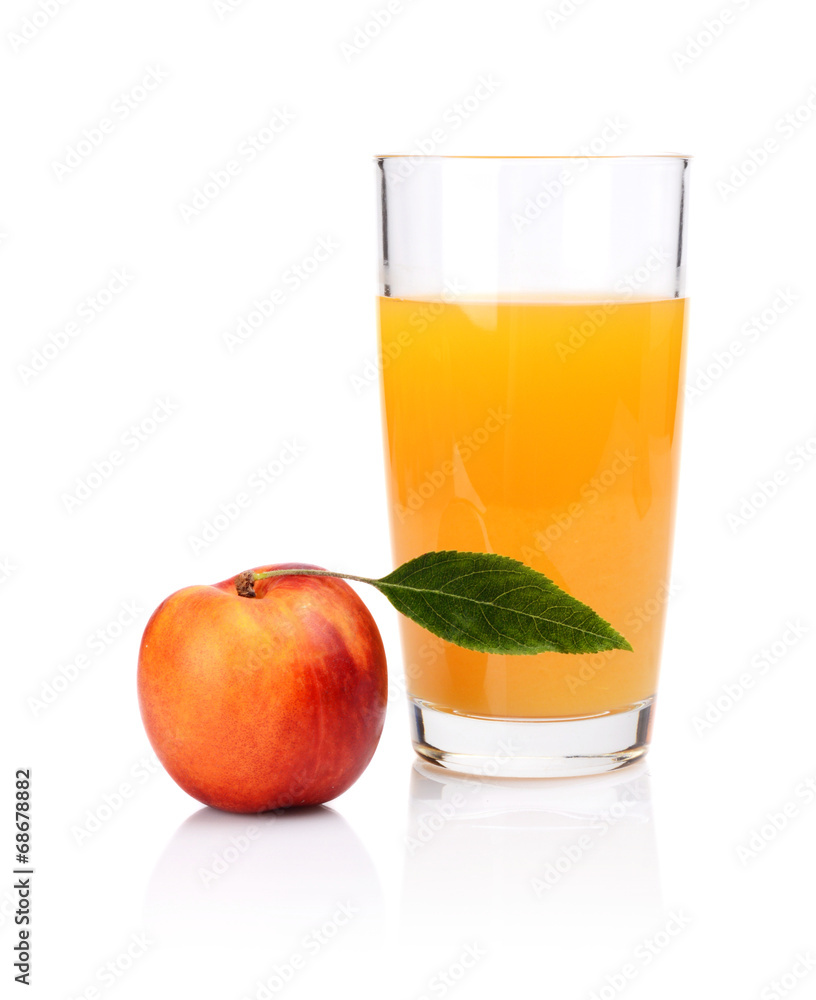 Close-up shot sliced orange nectarine with juice and leaf Close-up shot sliced orange nectarine with juice and leaf