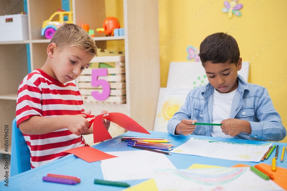 Cute little boys drawing at desk Cute little boys drawing at desk