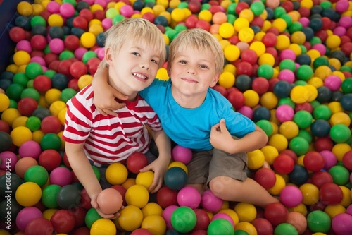 Happy children playing in ball pool