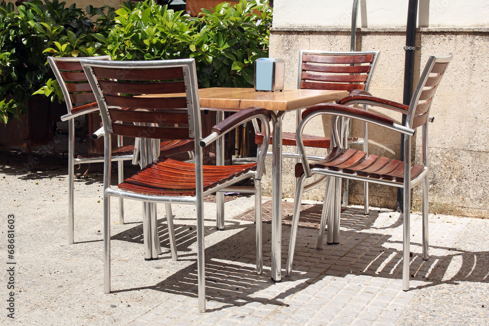 Street restaurant- wooden table and chairs