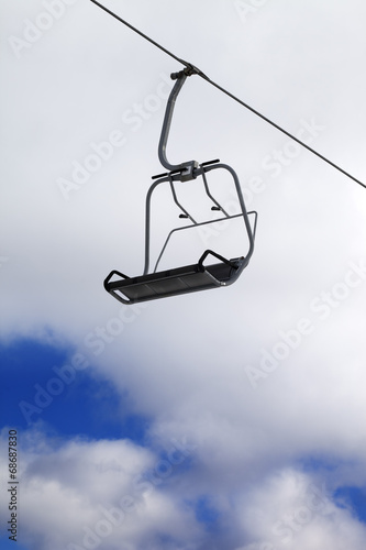 Chair-lift and cloudy sky