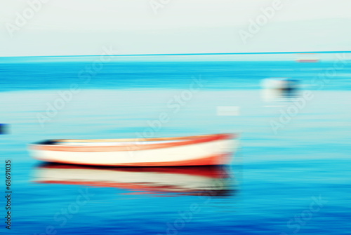 boats on lake and the horizon, motion blur