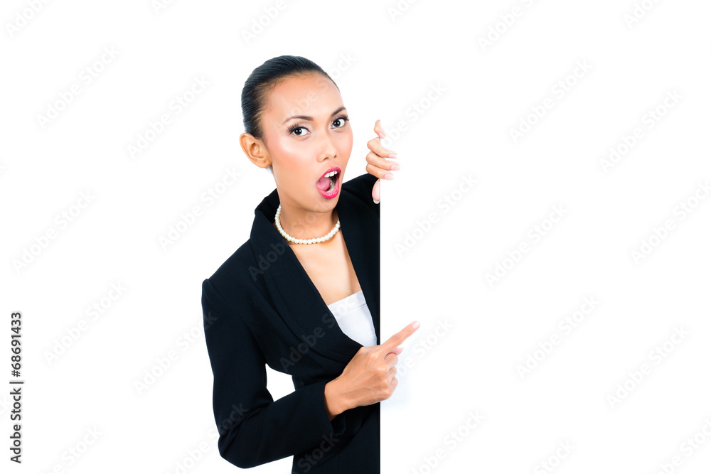 Asian businesswoman showing empty white board Asian businesswoman showing empty white board