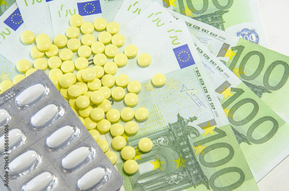 euro banknotes and tablets, symbol photo for costs of medication euro banknotes and tablets, symbol photo for costs of medication
