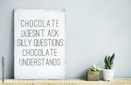 old  rustic poster with quote about chocolate and succulents